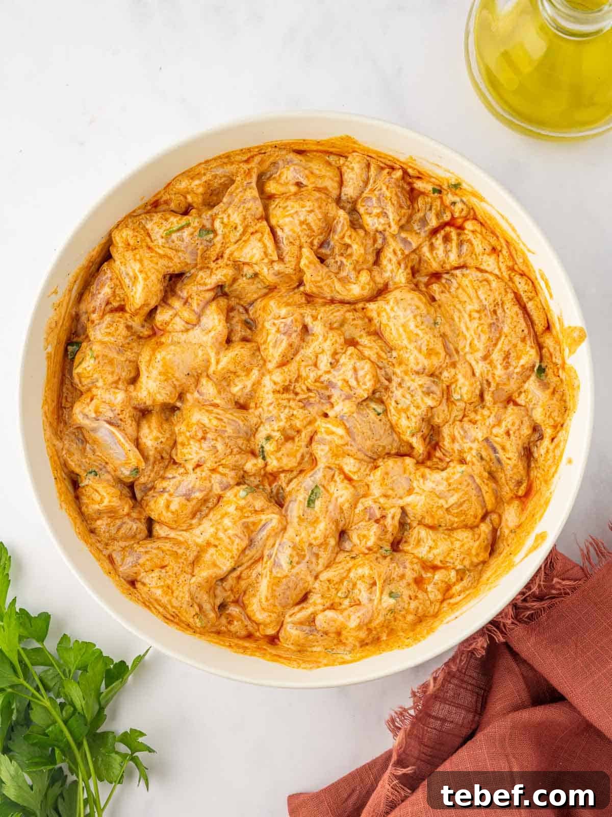 Juicy Oven-Baked Chicken Skewers: Simple Weeknight Recipe 6 A bowl of marinated chicken pieces.
