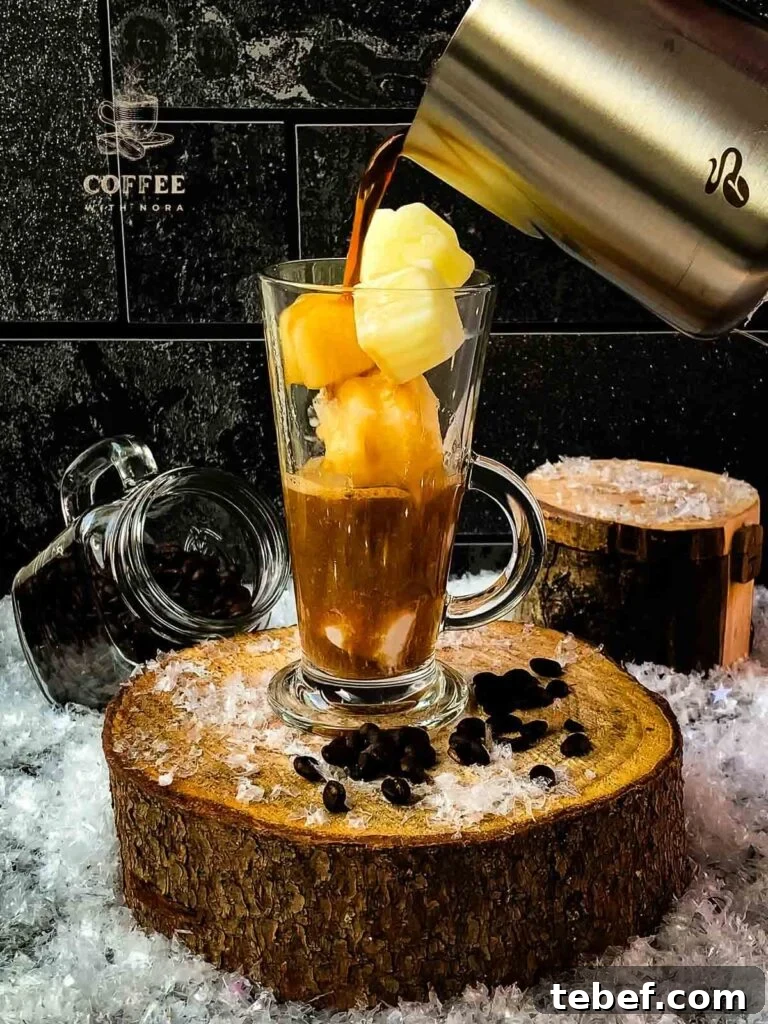 Creamy Iced Coffee with Milk Recipe: Chilled Cafe-Style Drink 6 Fill the glass filled with frozen milk ice cubes with coffee.