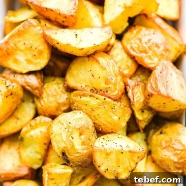 Ultra-Creamy Mashed Potatoes Recipe for Perfect Texture 13 a close up of a small baking dish filled with crispy roasted potatoes