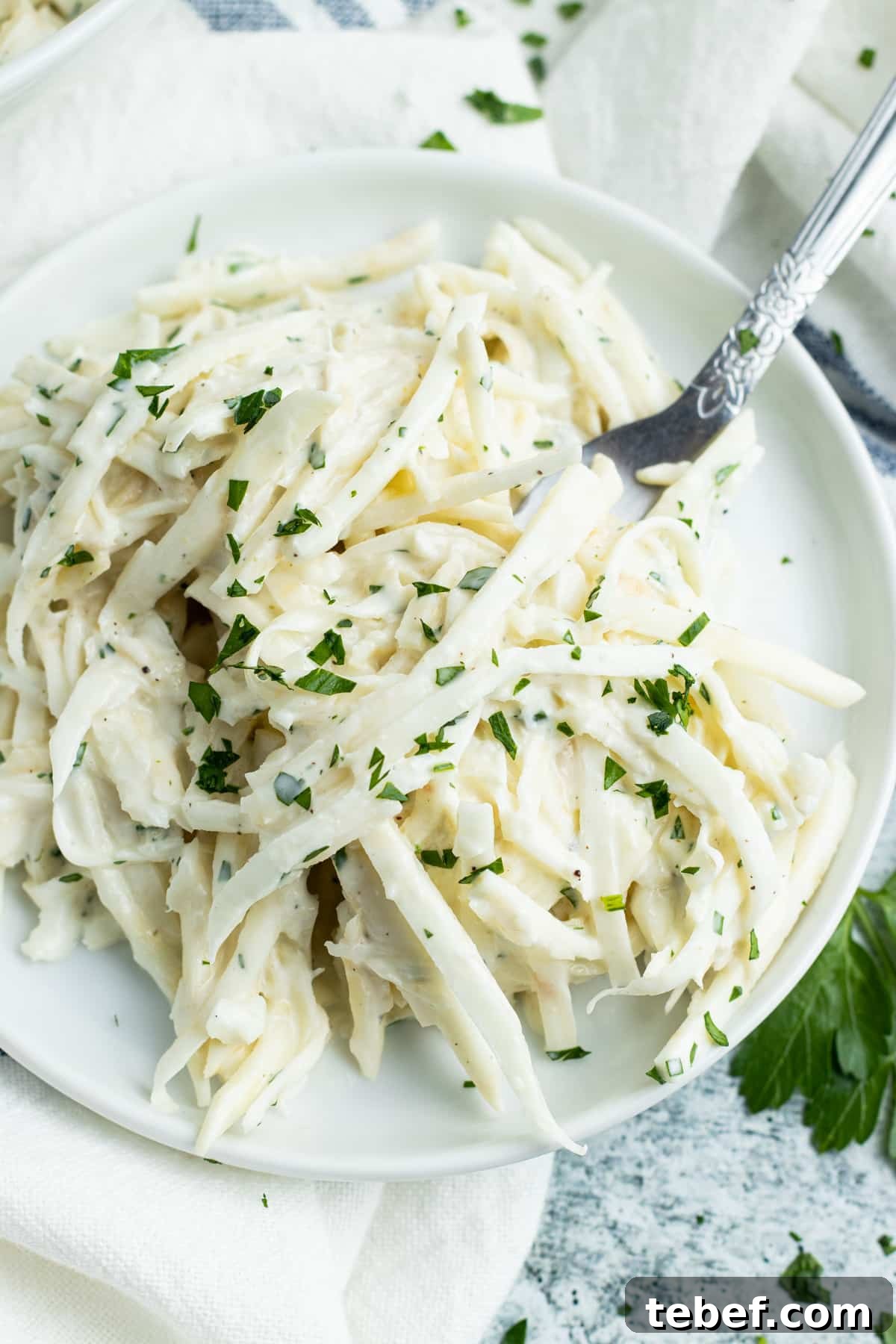 Celery Root Remoulade Recipe: Classic French Celeriac Salad 3 Plate of celery remoulade with a fork.