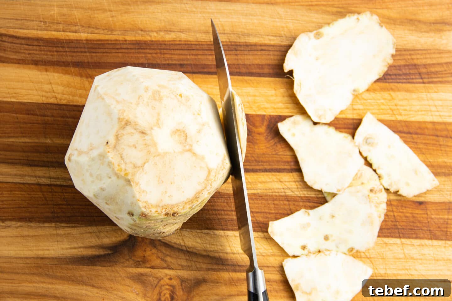 Celery Root Remoulade Recipe: Classic French Celeriac Salad 5 Picture of celery root being peeled with knife.