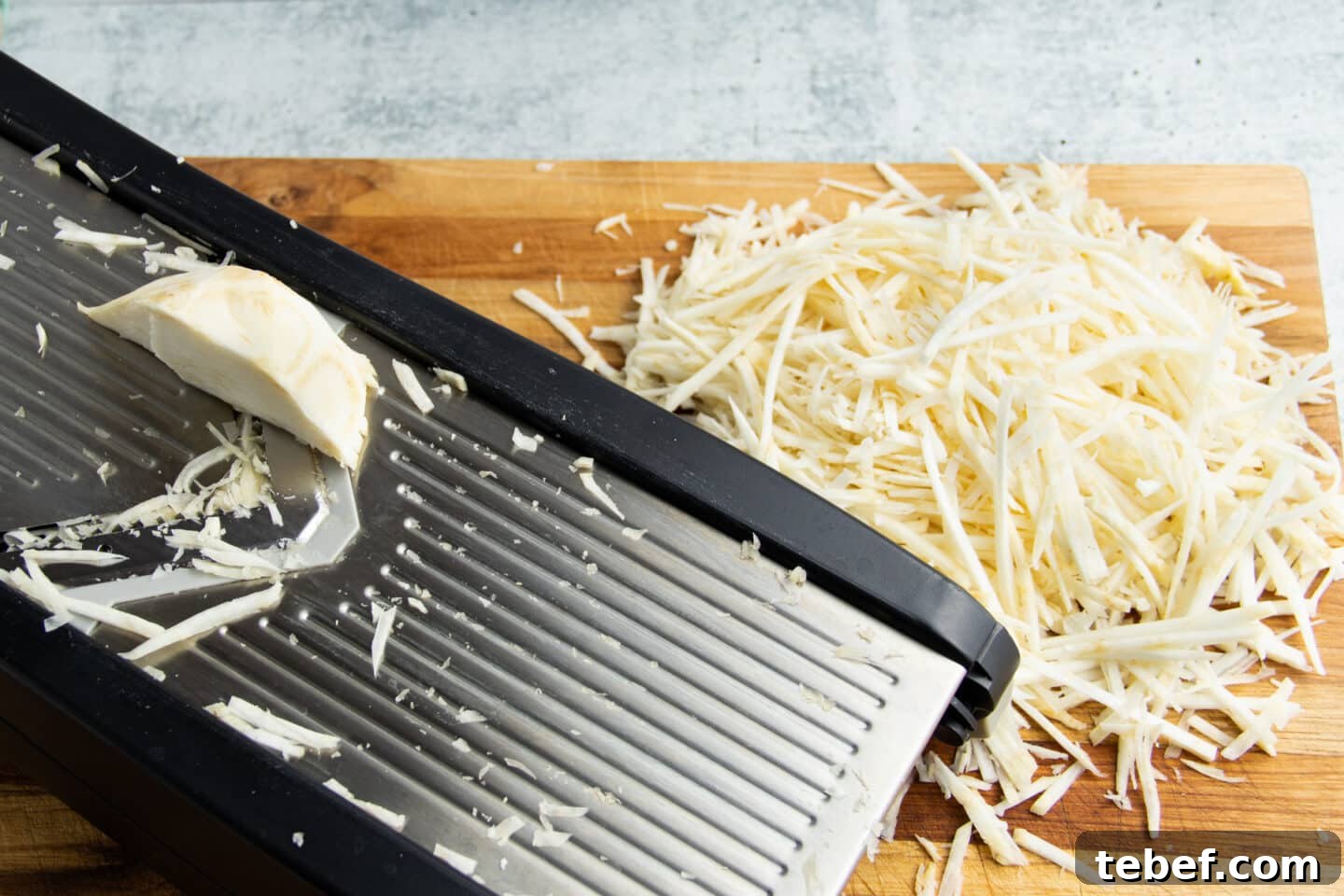 Celery Root Remoulade Recipe: Classic French Celeriac Salad 6 Picture of the celeriac being cut in julienne sticks on the mandoline.