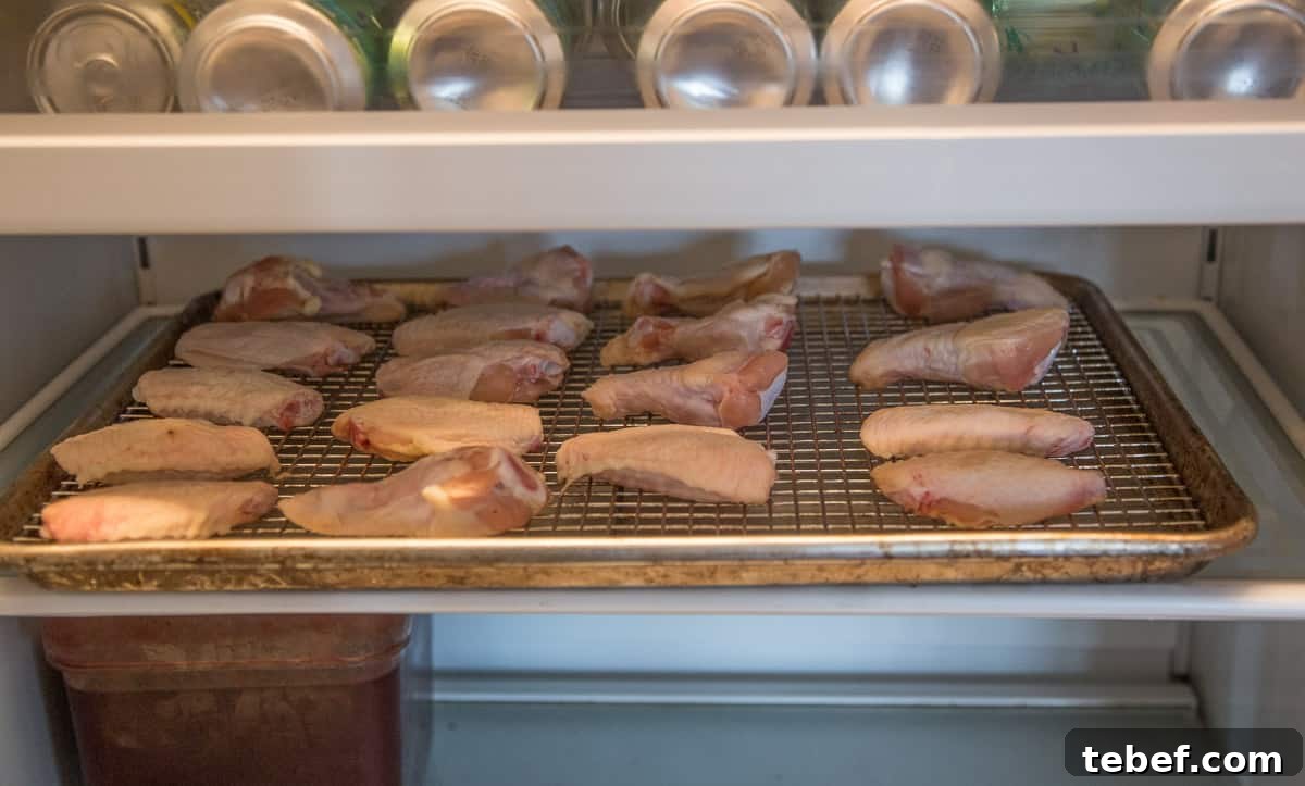 How to Cut Whole Chicken Wings Into Flats and Drumettes for Perfect Portions 11 Chicken wings dehydrating in a refrigerator.