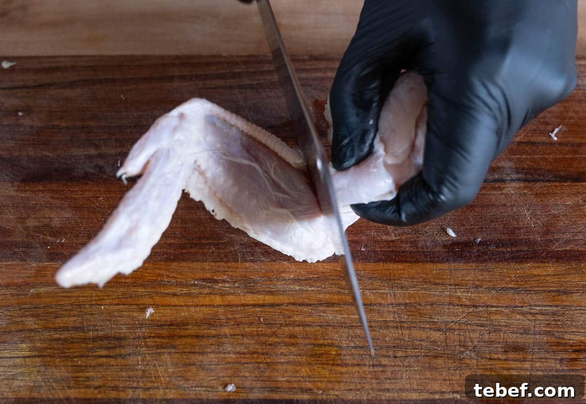 How to Cut Whole Chicken Wings Into Flats and Drumettes for Perfect Portions 5 separating drums and flats of a whole chicken wing step 1.