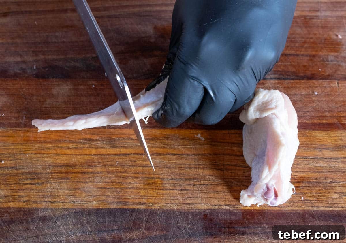 How to Cut Whole Chicken Wings Into Flats and Drumettes for Perfect Portions 9 Separating the winglet from a whole chicken wing.