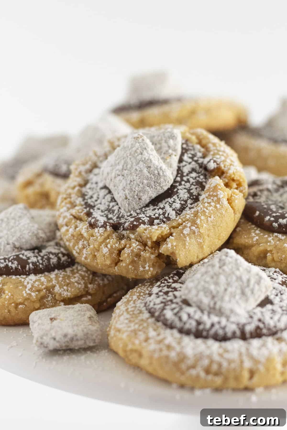 A tray of muddy buddy cookies with chocolate ganache.
