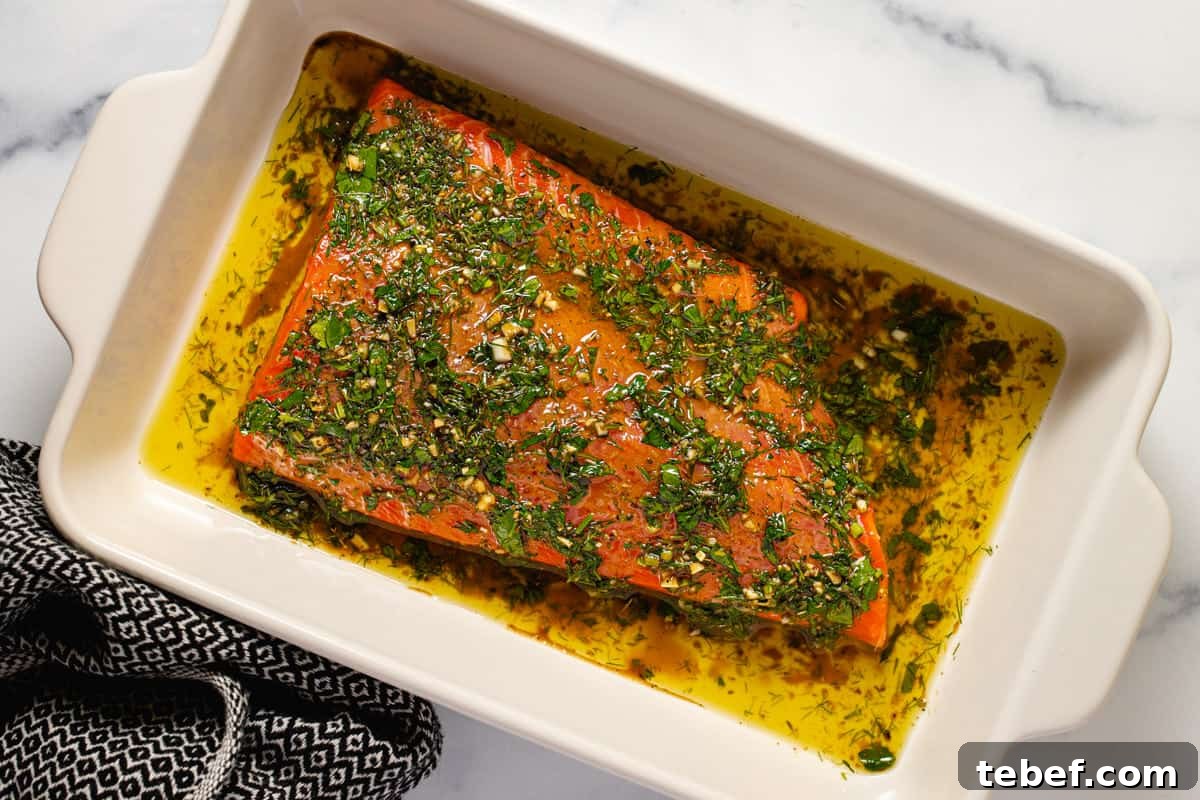 Greek Salmon Bowl Recipe with Lemon-Dill Yogurt Dressing 4 Large white baking dish filled with marinated salmon