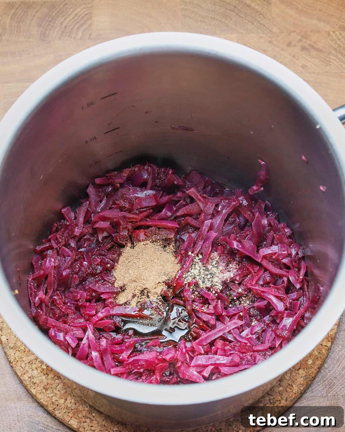 Photo showing the cooked red cabbage in the pan with the syrup, vinegar and spices added.