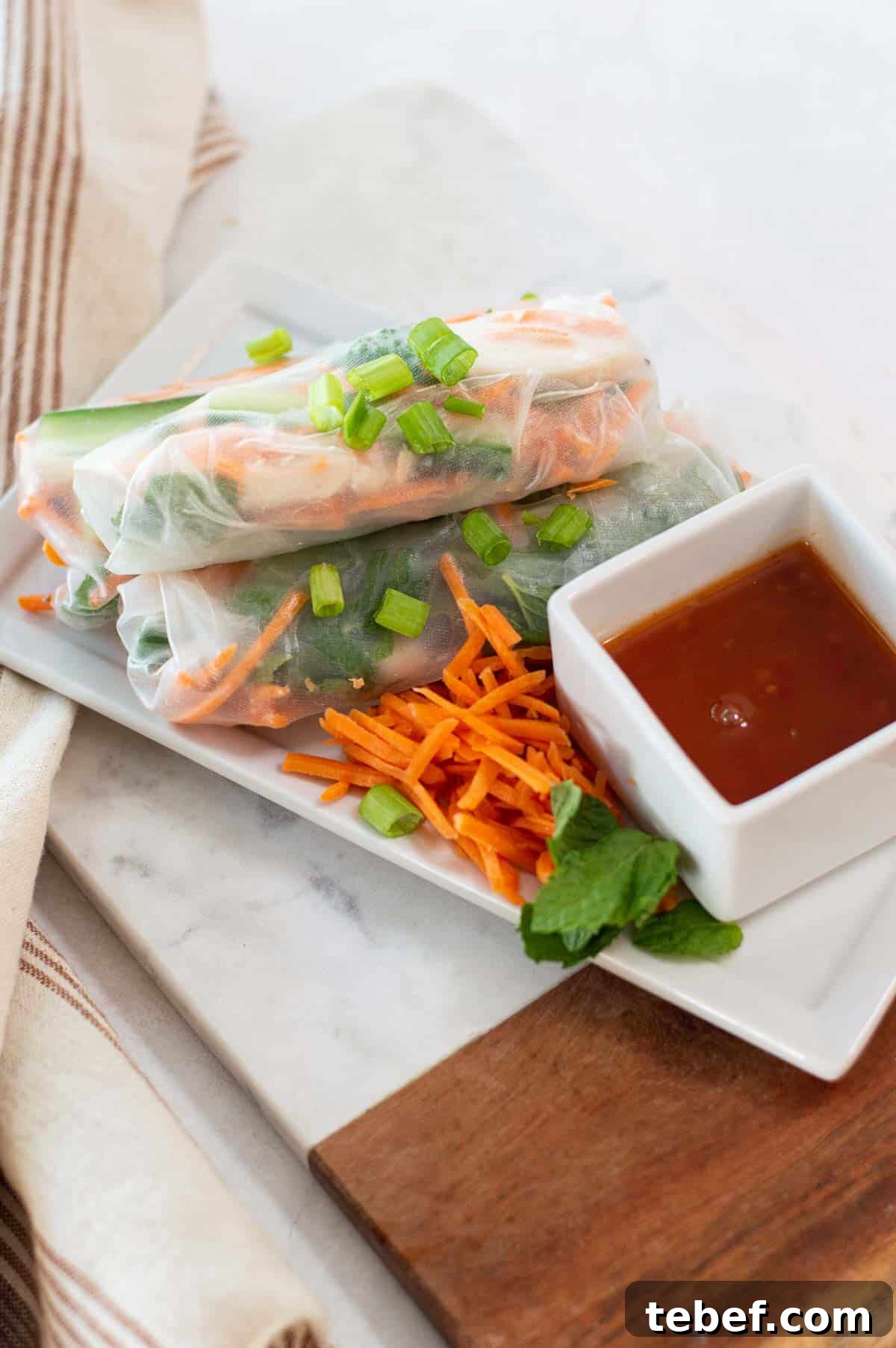 Gluten-Free Spring Rolls Ready in 10 Minutes 3 gluten free spring rolls on a white plate