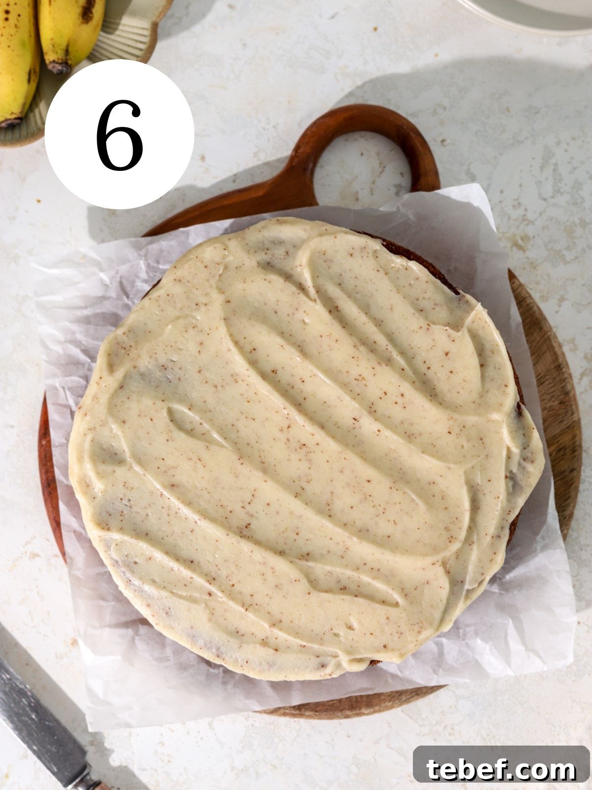 Moist Banana Olive Oil Cake Recipe for Perfect Homemade Dessert 9 A banana cake with brown butter glaze on parchment paper.