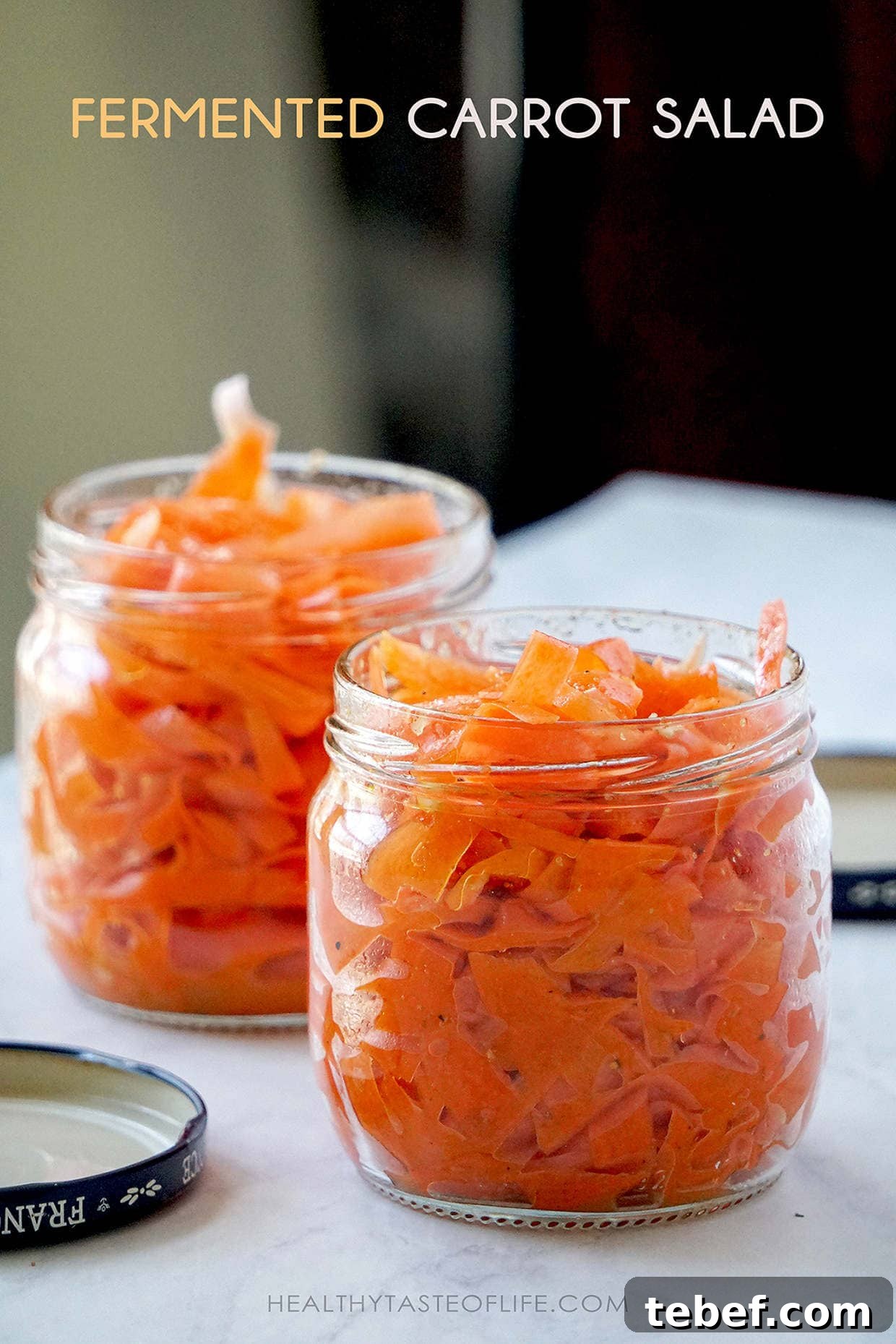 Tangy Fermented Shaved Carrot Salad Recipe for Gut Health 8 Storing shaved fermented carrots in the jar.