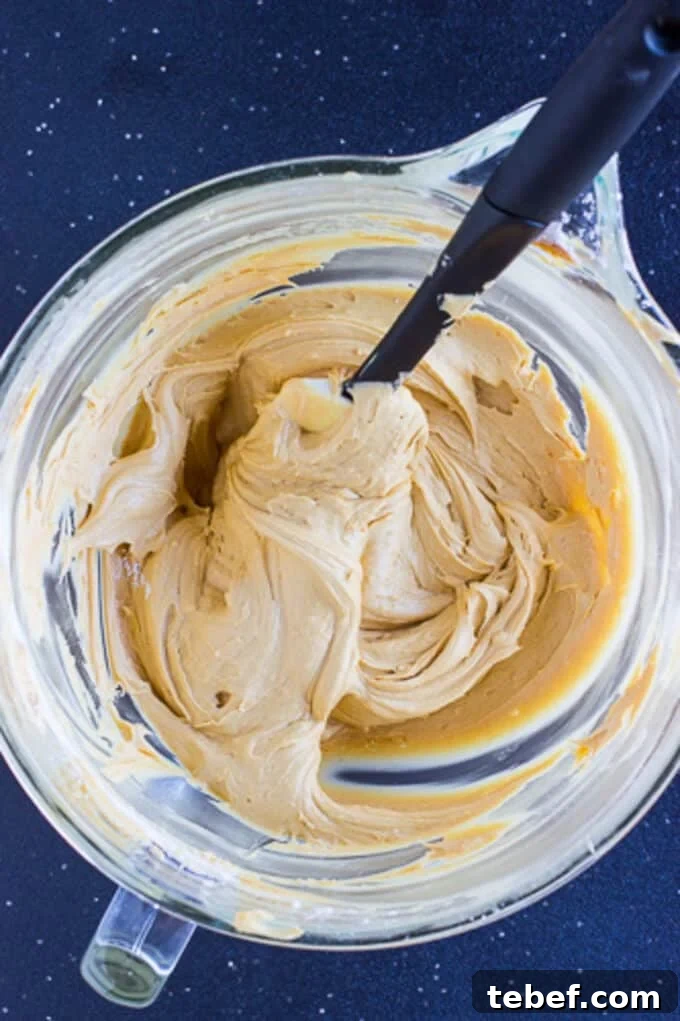 A glass mixing bowl of the peanut butter whoopie pie filling.