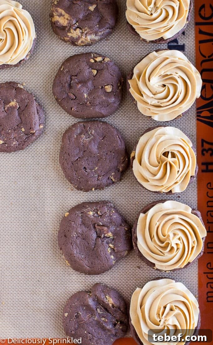 Filling the peanut butter whoopie pies with the peanut butter filling.