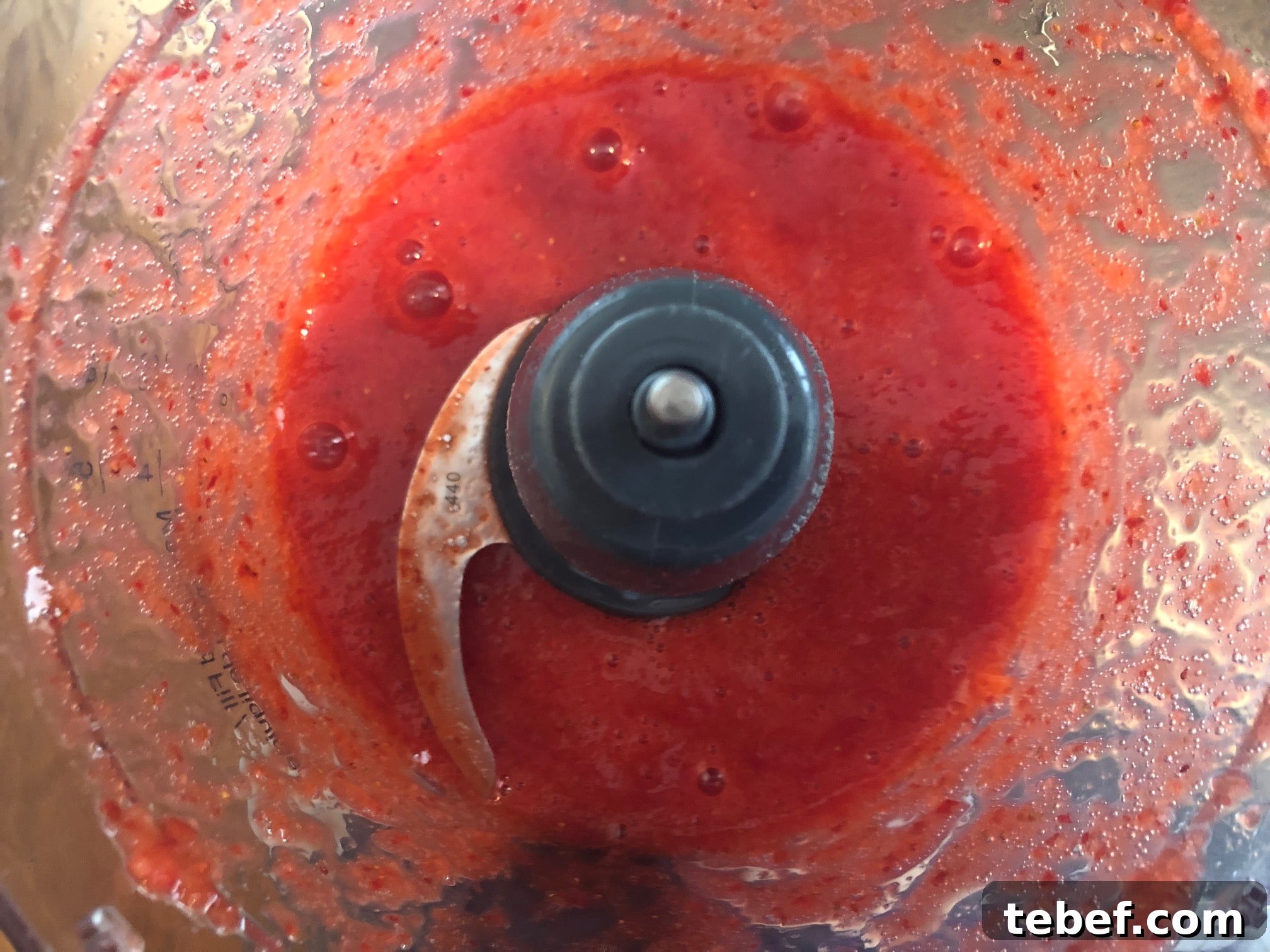 Pureed strawberries in food processor