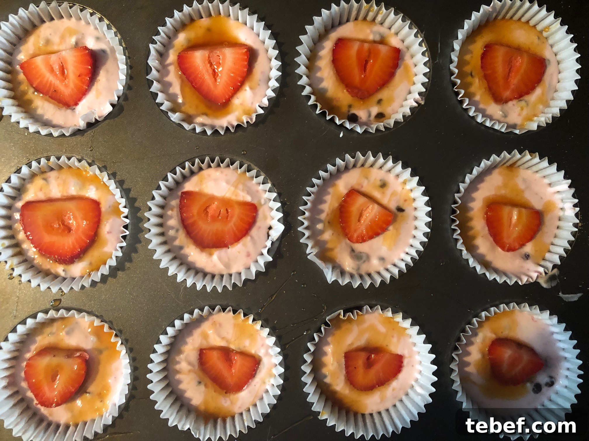 Yogurt cups topped with strawberries and caramel sundae sauce