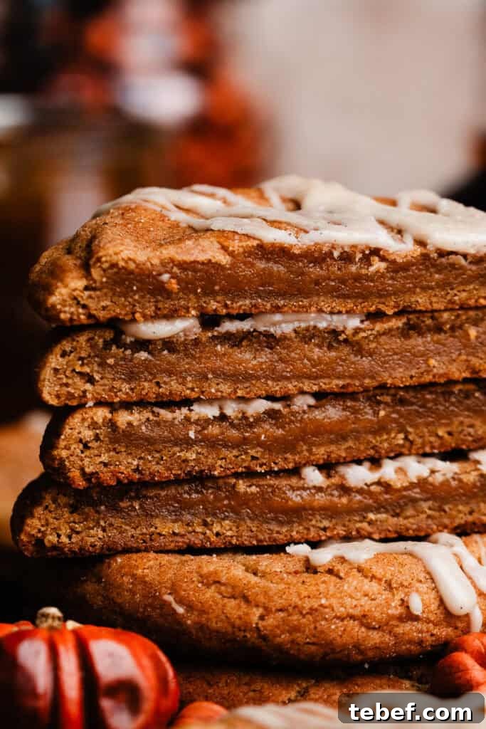 Chewy Pumpkin Cookies with Maple Glaze Recipe 12 A close-up on a stack of cookie halves, showing the chewy texture inside.