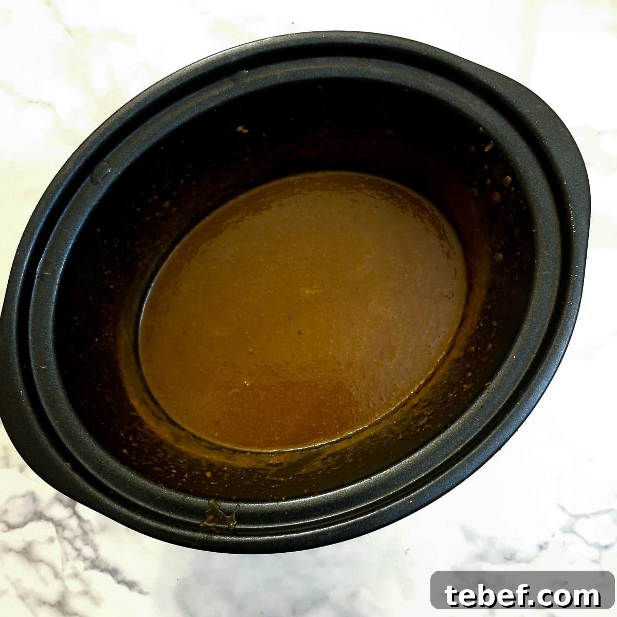 Melt-in-Your-Mouth Slow-Braised Beef Cheeks Recipe 12 Blended gravy in a slow cooker.