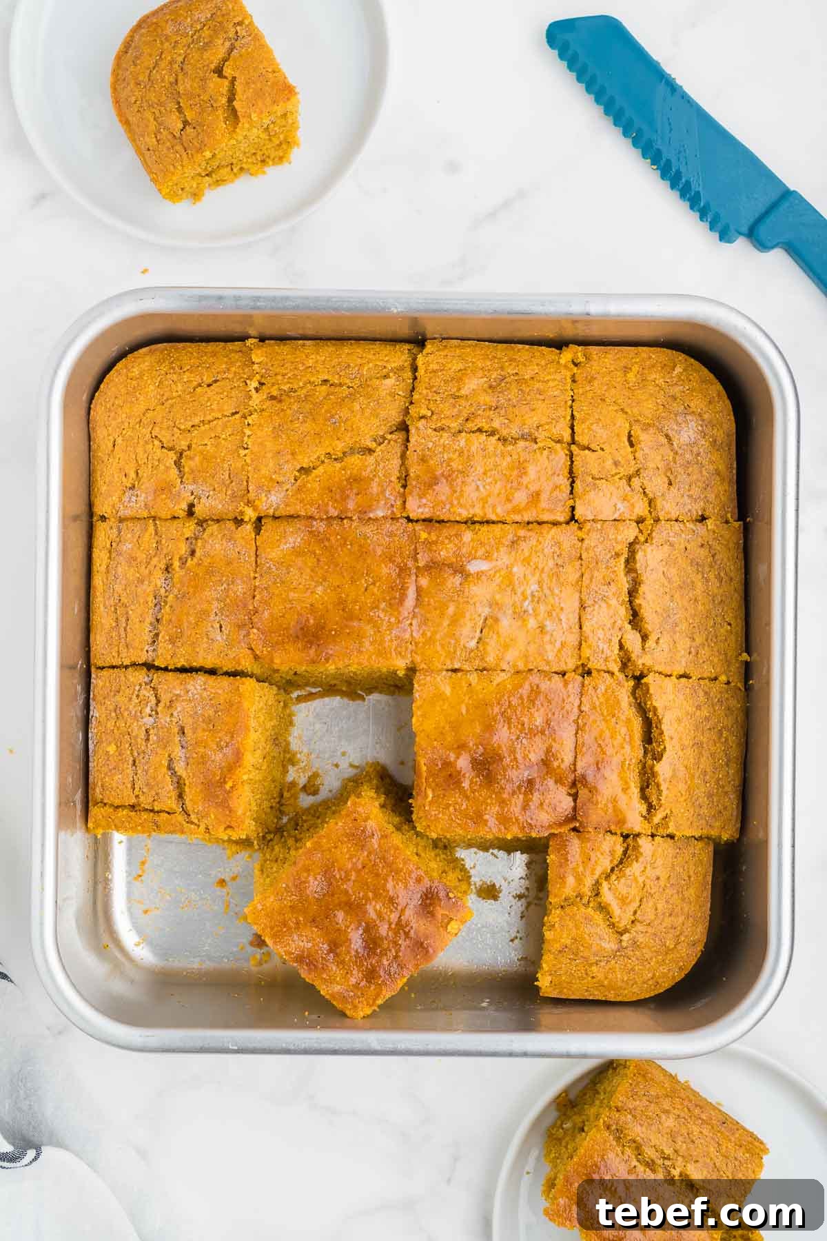 Moist Pumpkin Cornbread Recipe for Fall Baking 8 sliced servings of cornbread