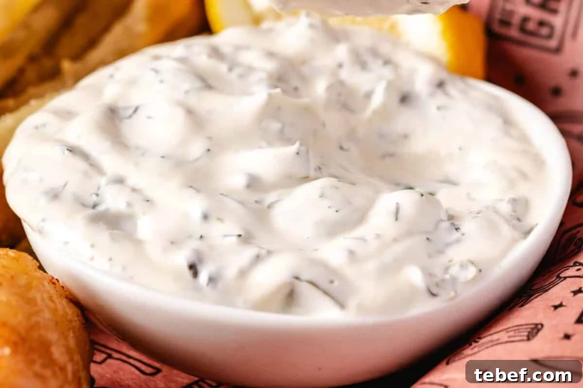 Creamy Dill Tartar Sauce Recipe for Seafood & Sandwiches 5 A white bowl of tartar sauce.