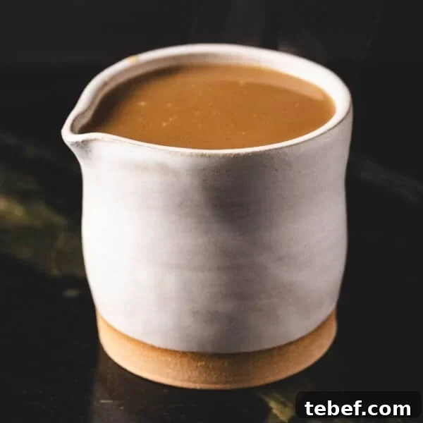 Creamy Dill Tartar Sauce Recipe for Seafood & Sandwiches 9 Au jus in white serving cup.