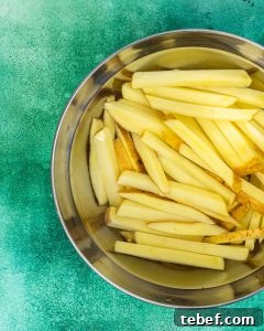 Loaded Cheddar Air Fryer Fries with Crispy Seasoning 7 Soaking Potatoes