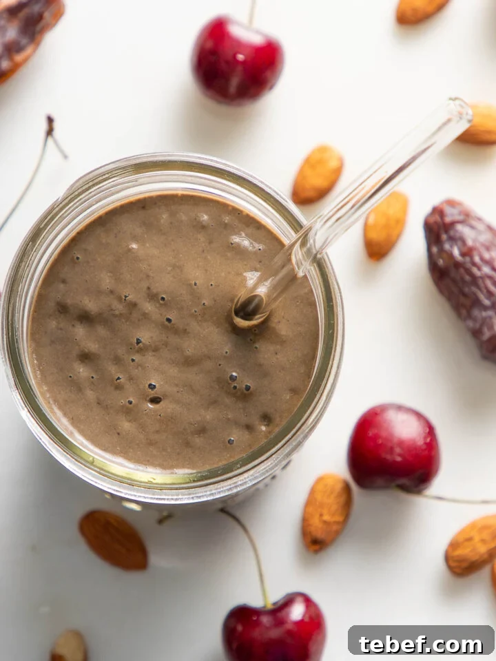 Chocolate Cherry Smoothie with a straw