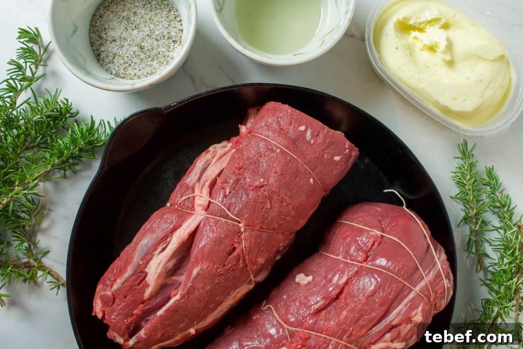 Herb-Crusted Rosemary Beef Tenderloin Recipe 2 beef tenderloin in cast iron with rosemary, salt, pepper, oil, and truffle butter