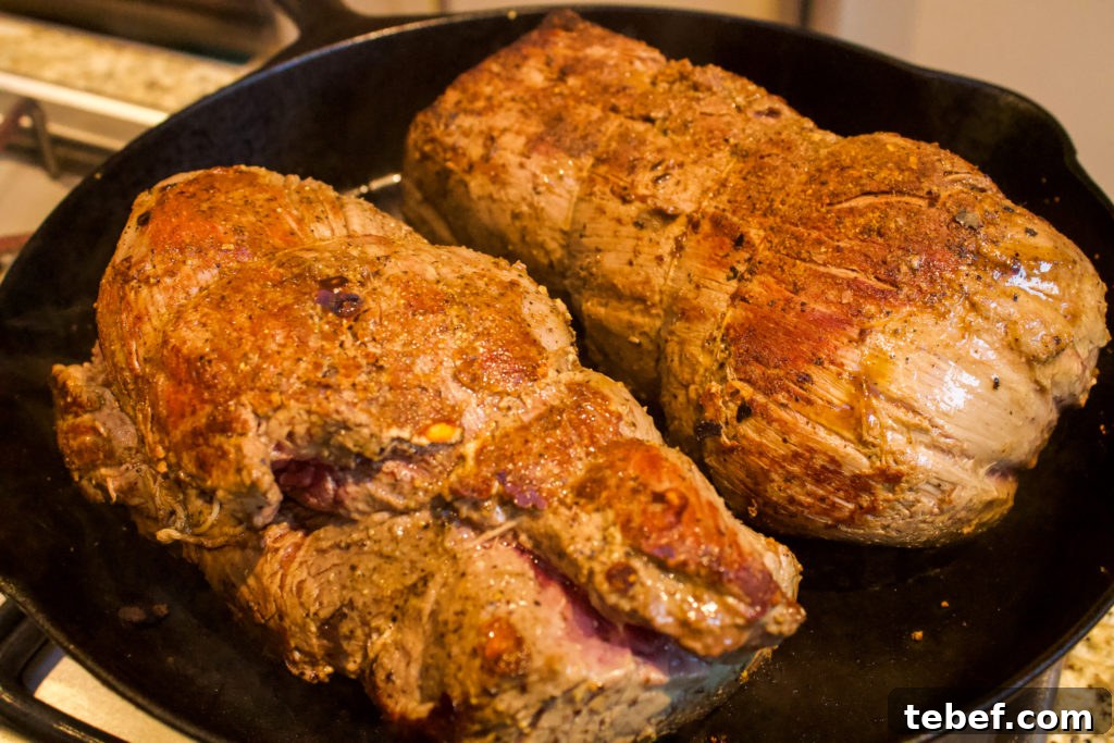 Herb-Crusted Rosemary Beef Tenderloin Recipe 4 beef tenderloin searing in cast iron