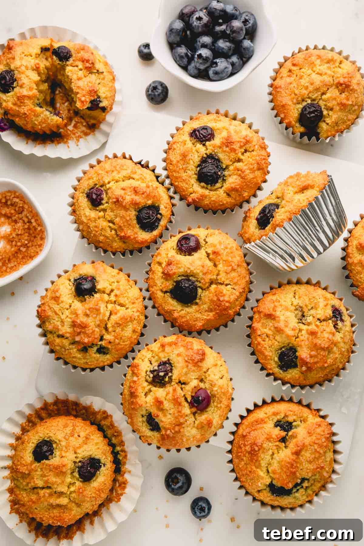 Almond Flour Blueberry Muffins Recipe — Moist Low-Carb Muffins 13 Almond flour blueberry muffins in muffin liners.