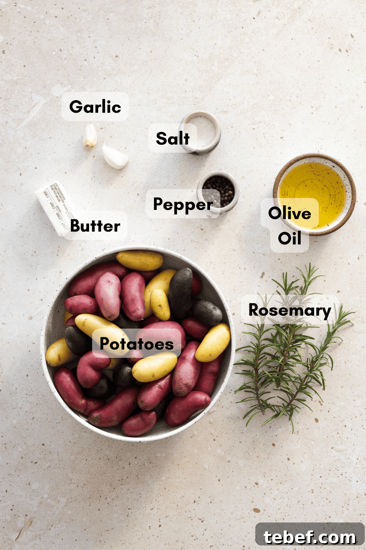Garlic Rosemary Smashed Fingerling Potatoes Recipe 3 Ingredients for smashed fingerling potatoes in small bowls.