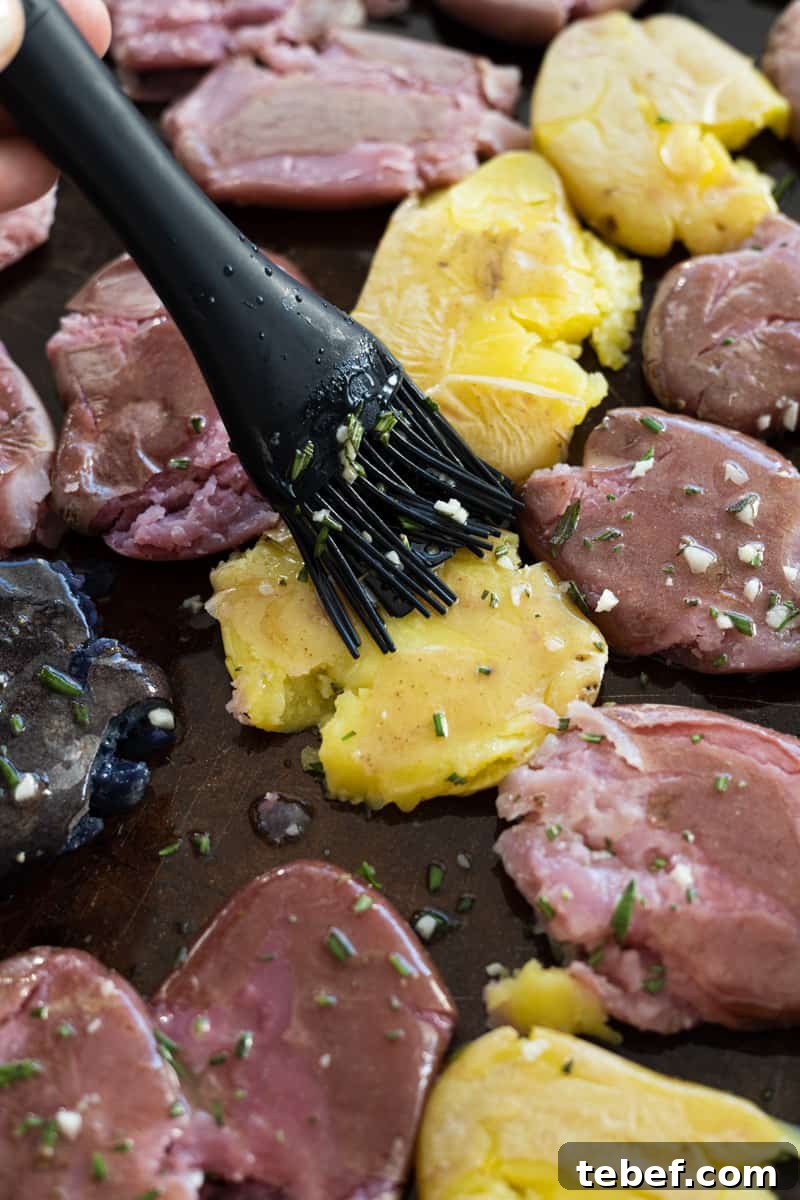 Garlic Rosemary Smashed Fingerling Potatoes Recipe 8 Brushing the potatoes with the butter mixture.