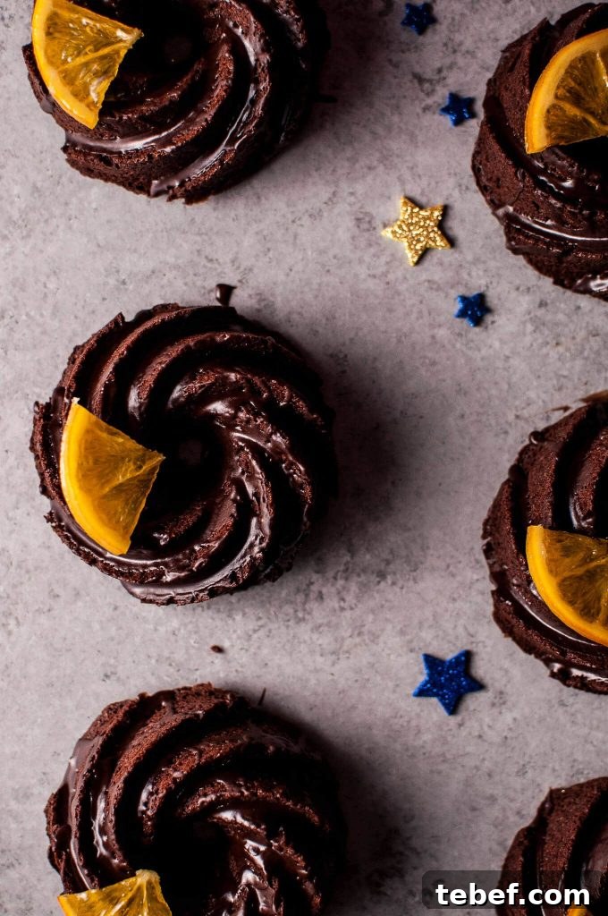 Mini Chocolate Bundt Cakes with Candied Orange Slices Recipe 5 close-up of mini chocolate bundt cakes beside star confetti