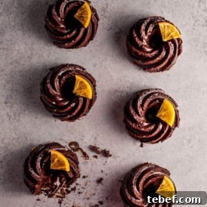 These mini chocolate bundt cakes with candied orange slices are packed full of chocolatey goodness and topped off with a festive touch.