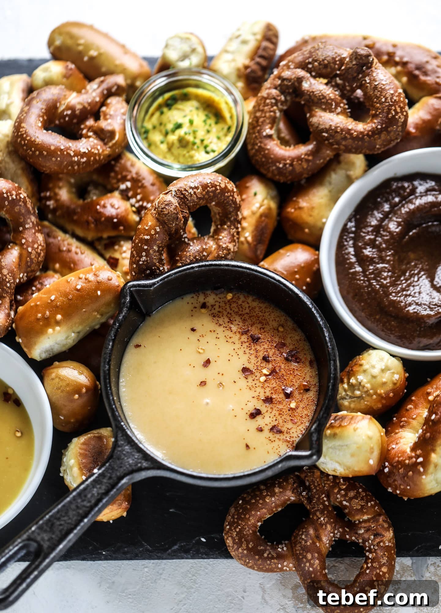 Pumpkin Beer Flight with Hot Pretzel Bar Ideas for Fall Entertaining 6 This is the cutest way ever to serve the best pumpkin beer! If you do a pumpkin beer party of a pumpkin beer tasting, this pumpkin cooler is an adorable (and easy!) way to make things festive. Kick it up with a hot pretzel bar and lots of dipping sauce too! I howsweeteats.com #pumpkin #beer #cooler #softpretzel #fall #cheese