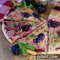 A subtly sweet fruit pizza made with blackberry jam, blackberries and marscapone cheese