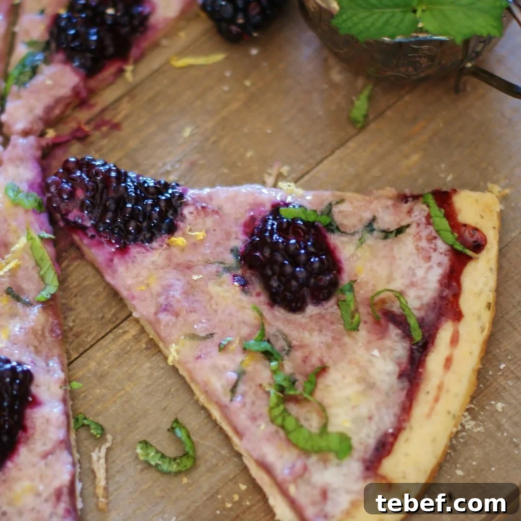 This blackberry mint pizza with subtly sweet marscapone cheese, plump blackberries, and blackberry jam is perfect for brunch, a savory dessert, coffee or tea time. 