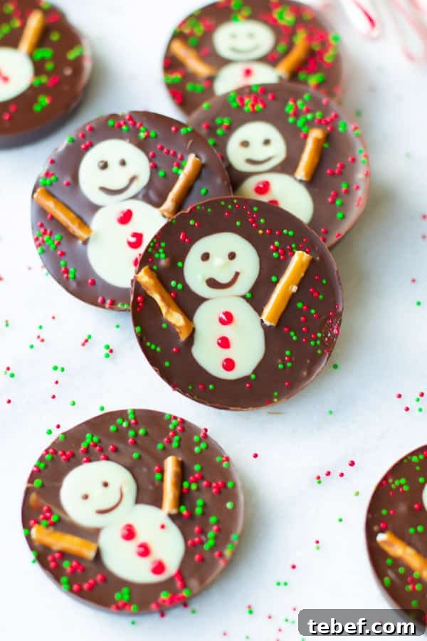snowman-chocolate-cups- These fun, festive and delicious Snowman Chocolate Cups are the perfect Christmas treats or wintertime snacks! These no-bake chocolate cups are also made with just a hand full of ingredients! snowman-chocolate-cups- These fun, festive and delicious Snowman Chocolate Cups are the perfect Christmas treats or wintertime snacks! These no-bake chocolate cups are also made with just a hand full of ingredients!