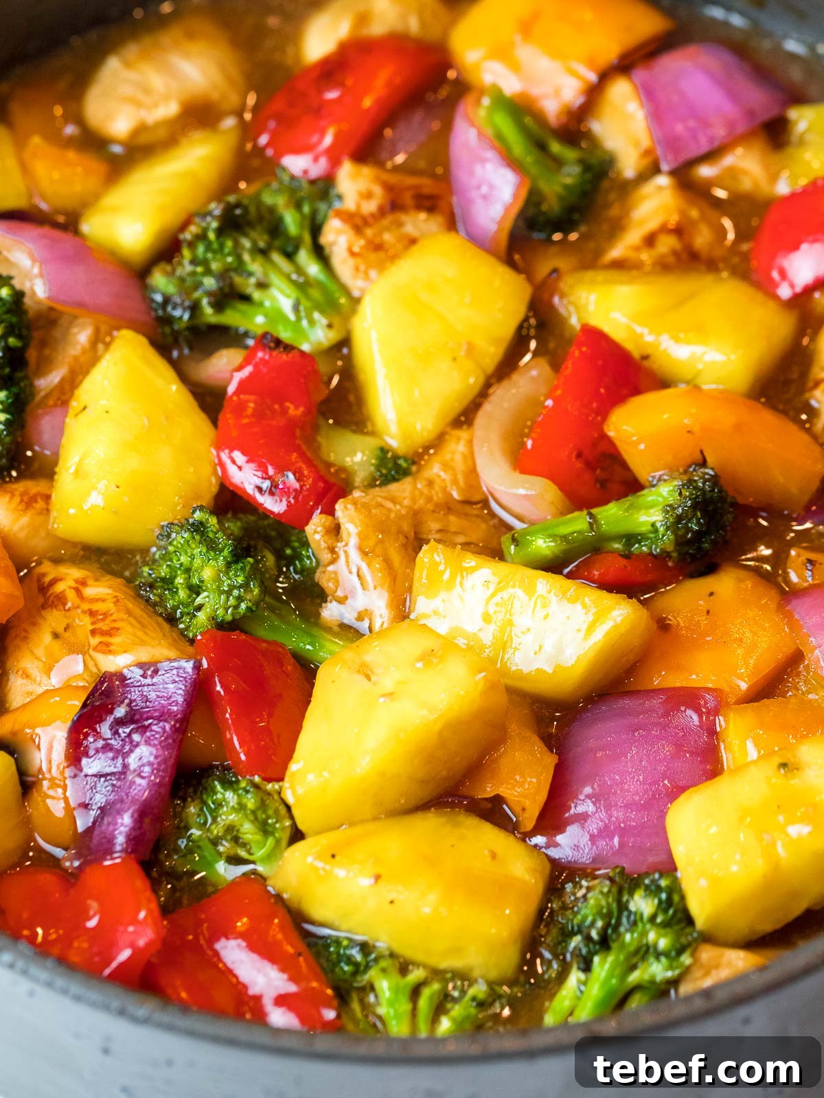 Hawaiian pineapple chicken stir fry with red peppers and broccoli