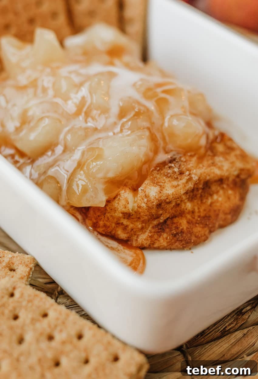 Smoked Cream Cheese with Apple Pie Flavor: Recipe & Tips 9 apple pie filling topped smoked cream cheese in a small white baking dish
