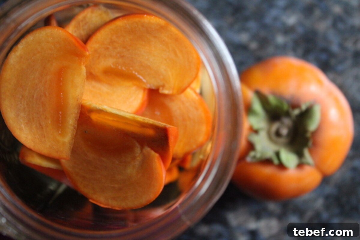 How to Make Persimmon Wine at Home: Step-by-Step Guide 3 Persimmons in jar for Persimmon Wine
