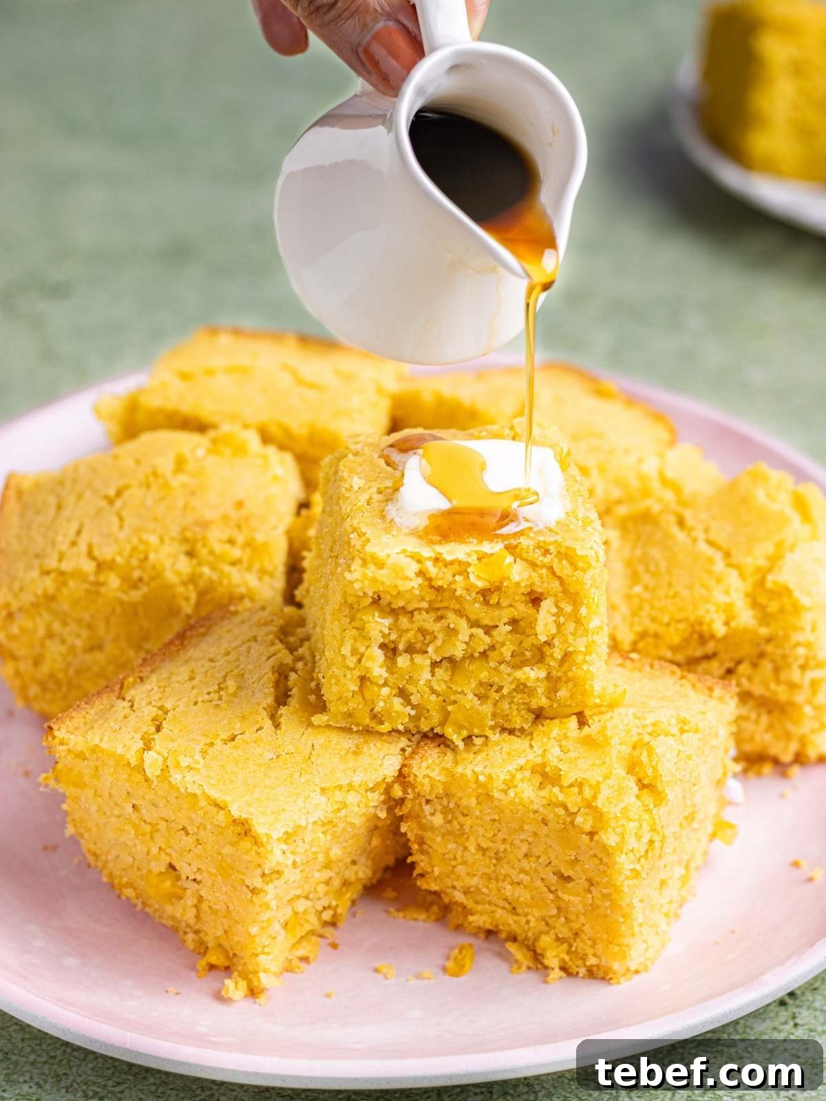 Moist Eggless Cornbread Recipe Without Eggs 2 drizzling maple syrup over cornbread.