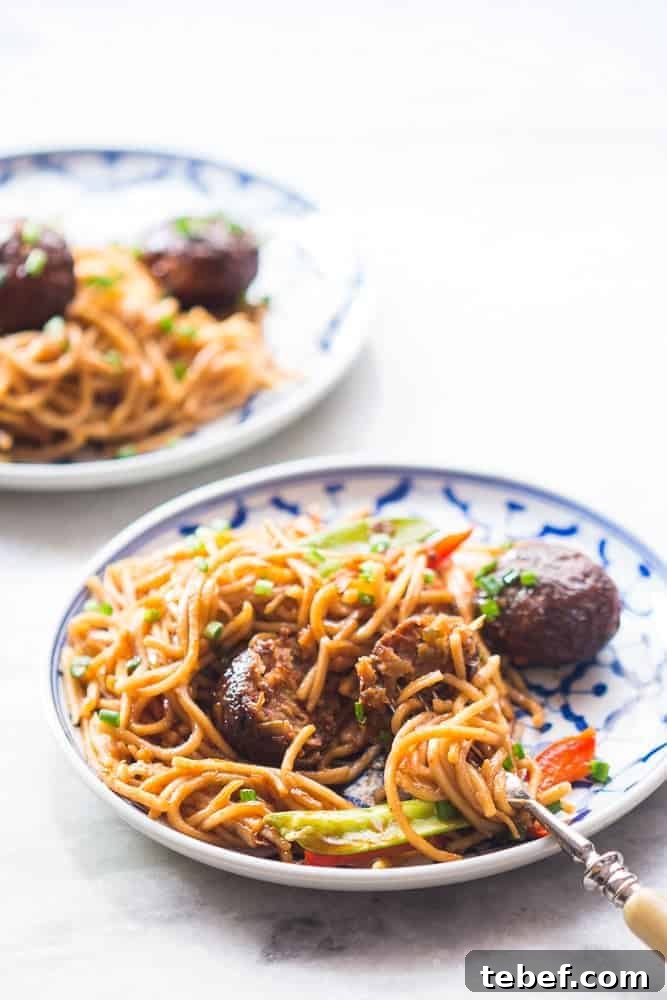 One-Pan Veg Noodles with Manchurian Stir-Fry (Indo-Chinese) 5 one pan veg noodle and manchurian stir fry served in a plate