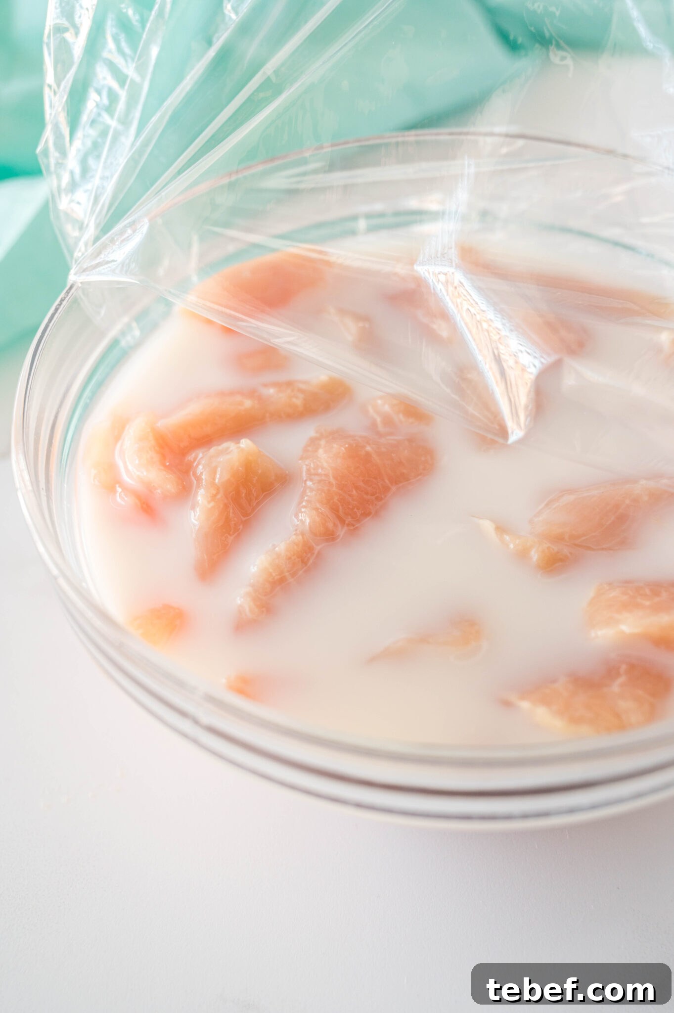 Copycat Chick-fil-A Grilled Nuggets Recipe: How to Make Them at Home 6 raw chicken in a bowl marinating to make chick fil a grilled nuggets