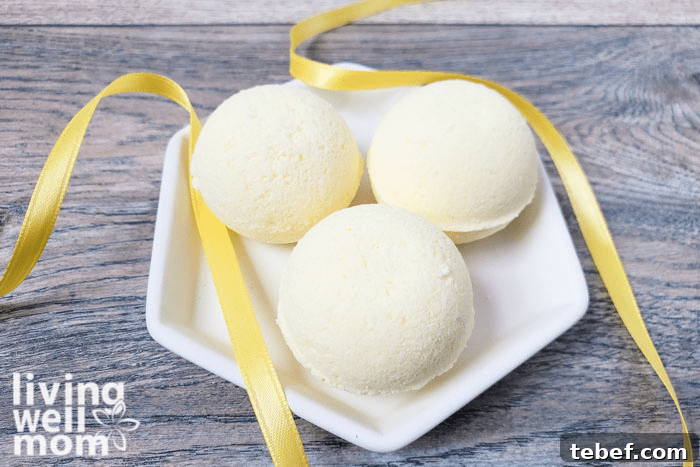 DIY Ultra-Hydrating Coconut Bath Bombs for Silky Skin 11 DIY Bath Bombs displayed on a glass plate.
