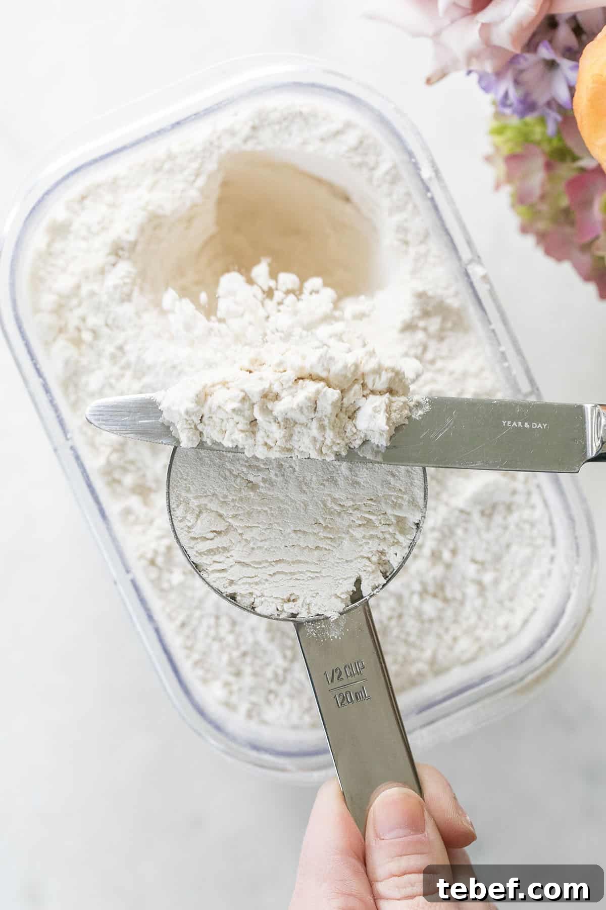 leveling flour with a butter knife
