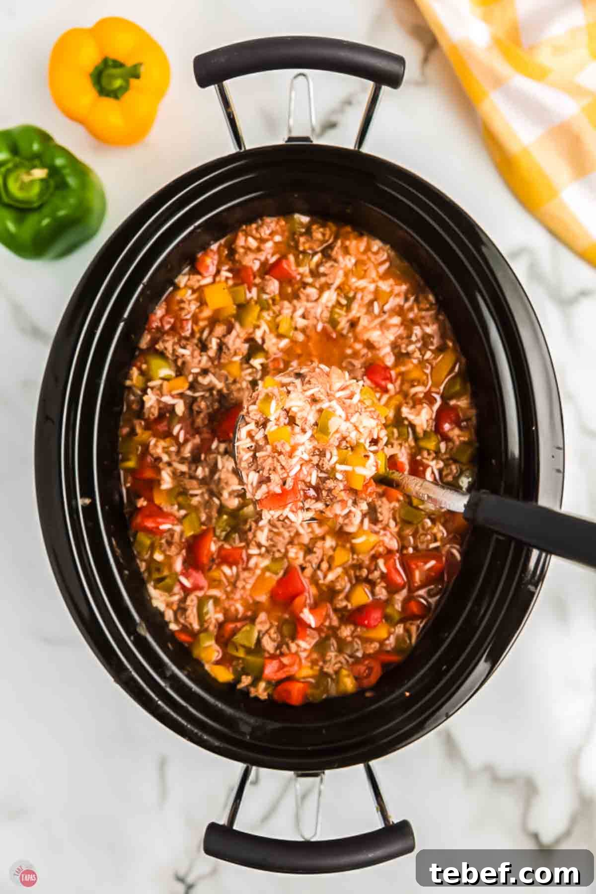 Slow Cooker Stuffed Pepper Soup Recipe for Comforting Weeknights 2 black crockpot with pepper and rice soup