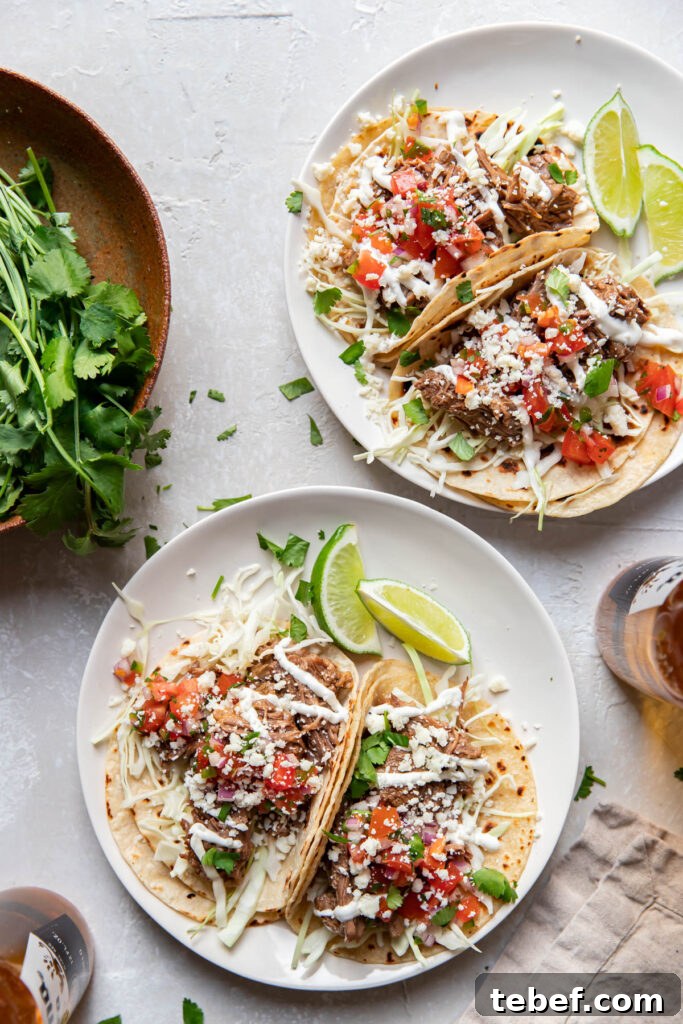 instant pot beef barbacoa tacos on a plate.