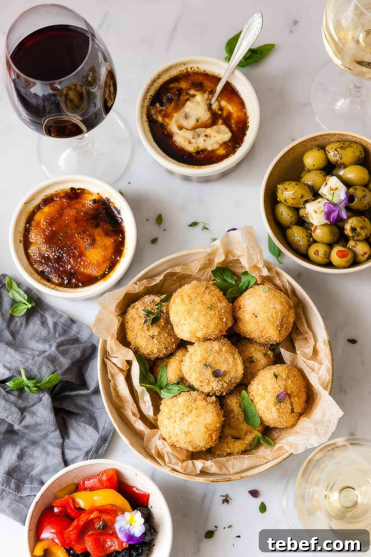Spanish Jamón Croquetas Recipe: Authentic Ham Croquettes Guide 2 Croquetas in a bowl with Spanish tapas.