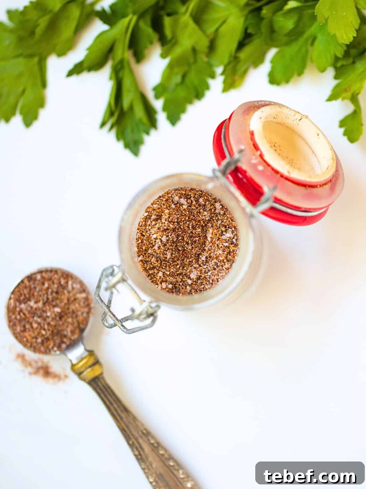Chili Seasoning Recipe Homemade chili seasoning in a small glass jar made with chili powder, onion powder, cumin, garlic powder, salt, and cayenne.
