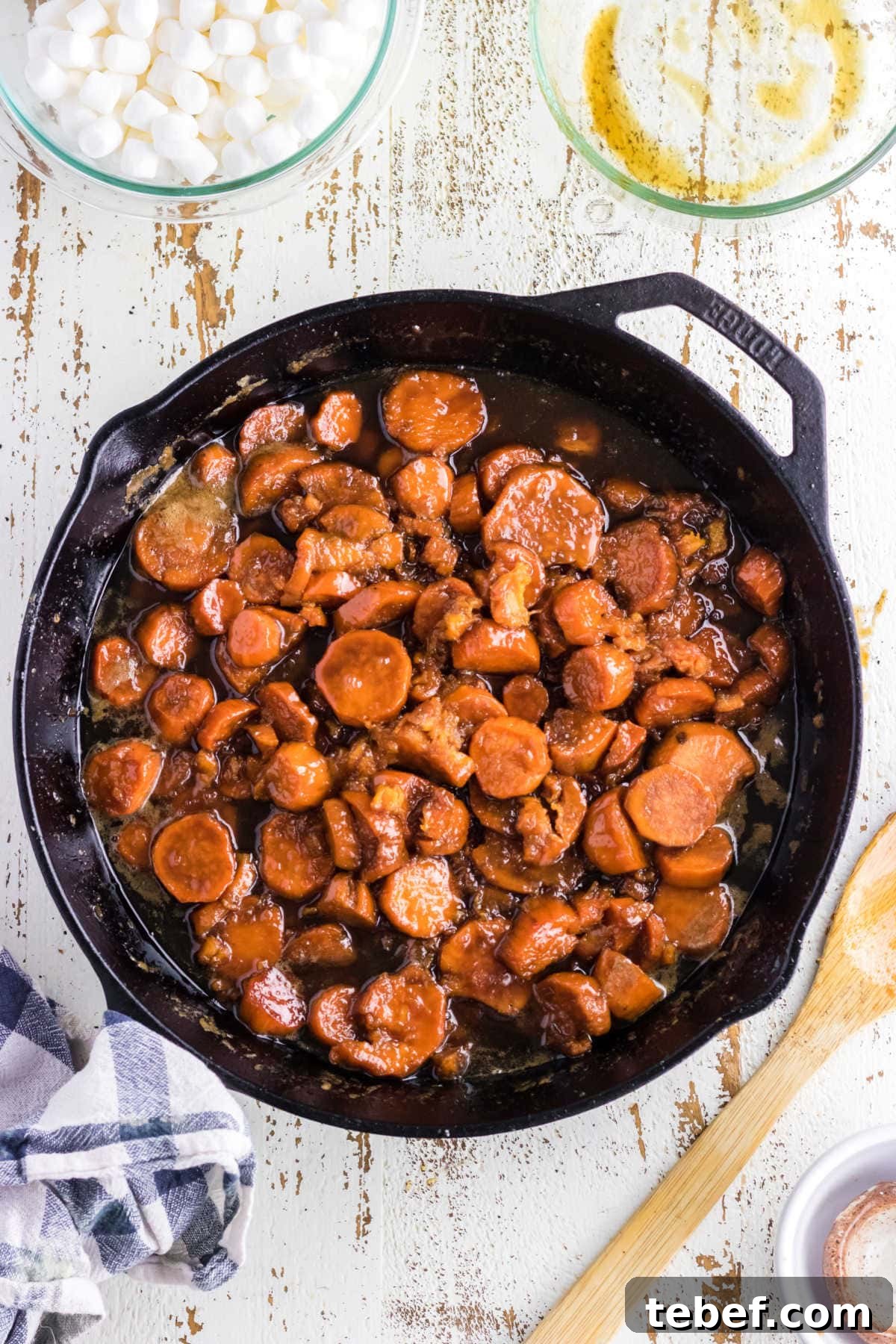Southern Candied Yams Recipe with Brown Sugar and Pecans 6 Glazed sweet potatoes in the skillet.